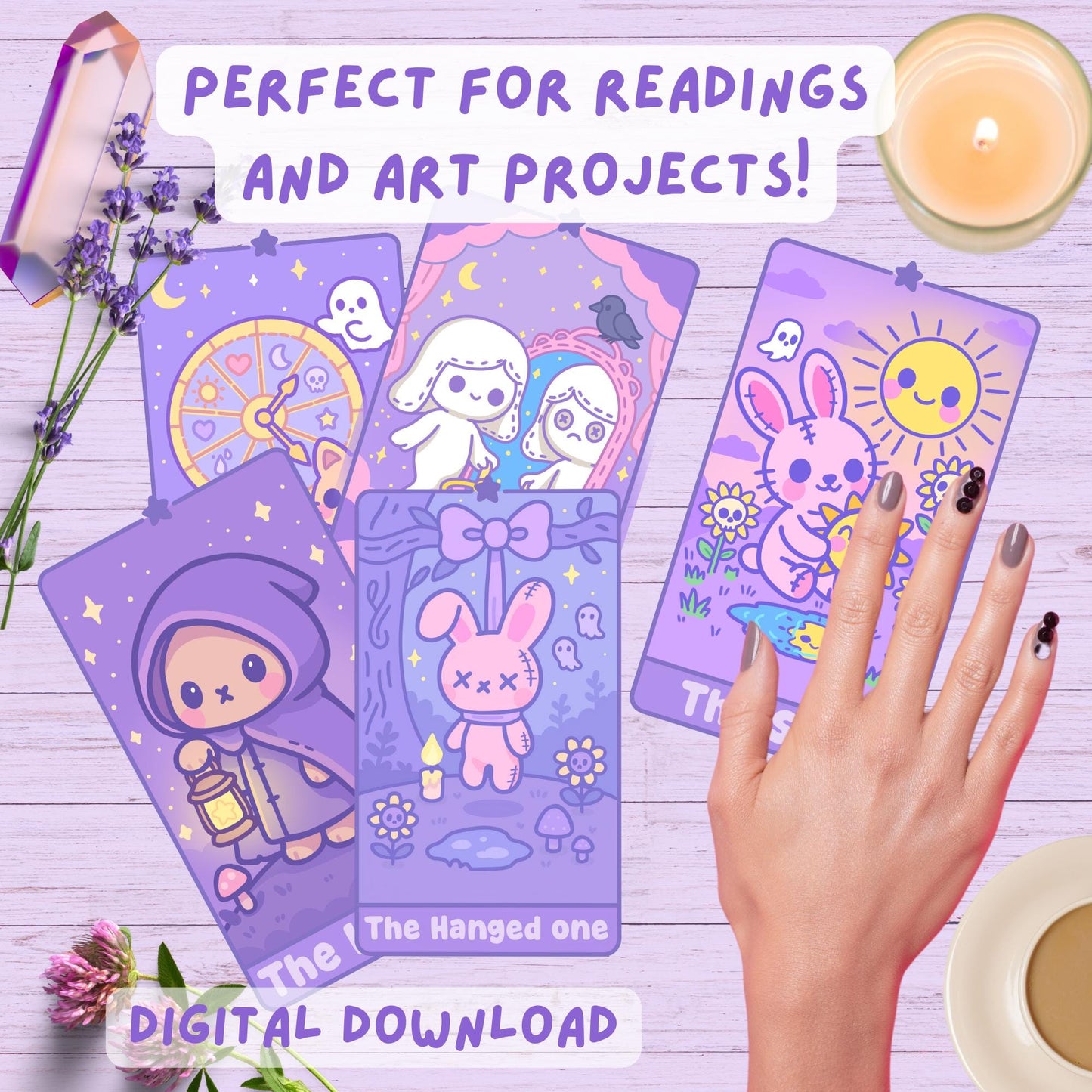 DefaultKawaii spooky-cute tarot cards laid out on a wooden surface with lavender, crystals, a lit candle, and a hand with grey nail art: featuring The Wheel of Fortune, Justice, The Hanged One (pink bunny with bow), and The Sun (bunny with smiling sun), with text 'Perfect for readings and art projects!' and 'Digital Download'